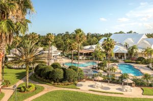 The outdoor pools and exterior of WorldMark Kingstown Reef, a Key West-style timeshare resort in Orlando, Florida.